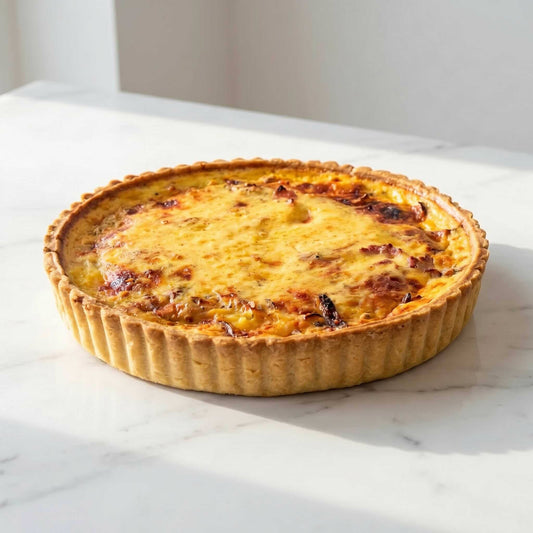 Whole Smoked Duck and Leek Quiche on white marble showing golden thin crust and creamy filling, 24cm family size, Carpina Bakery Singapore