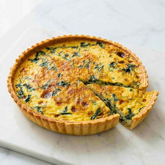 Bacon Spinach quiche sliced showing creamy custard crispy bacon and fresh spinach interior family size 24cm artisan quiche Singapore